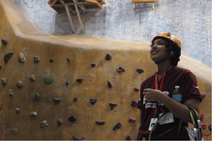 A Protege faces her fears by rock climbing at MetroRock in Boston